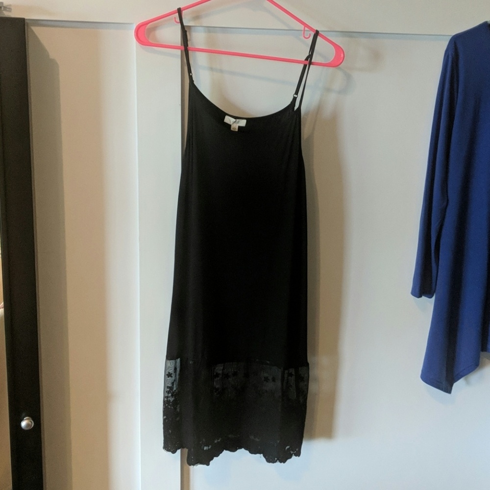 Womens black dress with lace bottom.